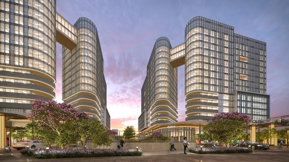 Render of Fairfox EON towers connected by a sky walk at dusk