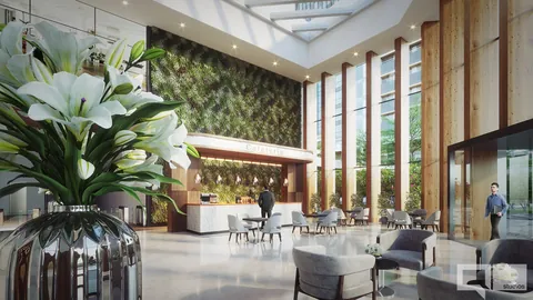 Render of the triple-height entrance lobby with a living green wall